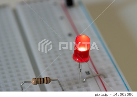 Red LED and Resistor on Electronic Breadboard Red LED and Resistor on Electronic Breadboard 143002090