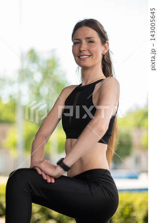 Pretty young woman in black looking confident and determined Pretty young woman in black looking confident and determined 143005645