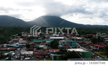 Arenal volcano rising over La Fortuna town 143007540