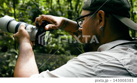 Wildlife photographer capturing nature moments in Arenal Volcano National Park 143008383