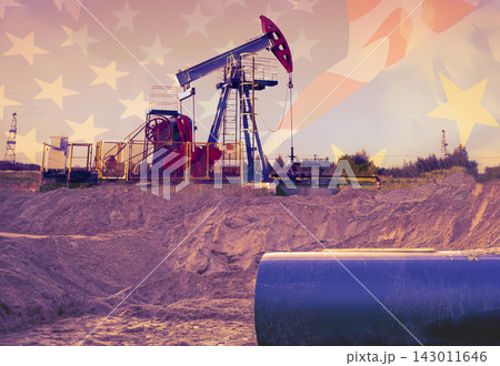 Extraction of petroleum on flags of United States and European Union. Oil Pump Jack at Oil Field. 143011646