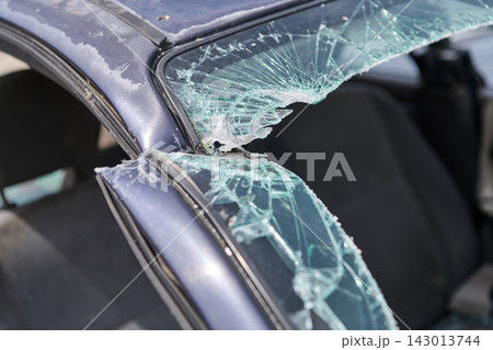 Damaged Car With Shattered Windshield After Collision Showing Broken Glass And Bent Frame Damaged Car With Shattered Windshield After Collision Showing Broken Glass And Bent Frame 143013744