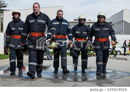 Firefighters Walking Together in Uniforms Outside Fire Station During Training Exercise and Emergency Preparedness 143014028
