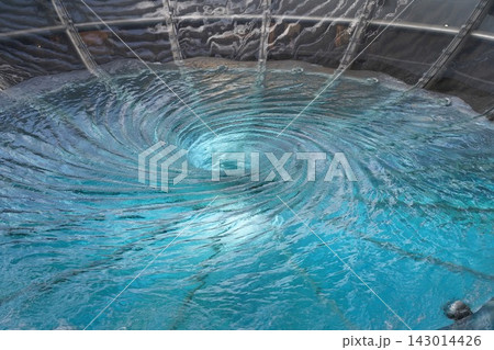 Mesmerizing Blue Water Vortex in Modern Installation Mesmerizing Blue Water Vortex in Modern Installation 143014426