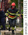 Firefighter Running With Hose In Full Gear During Urban Emergency Response Training Exercise 143015525