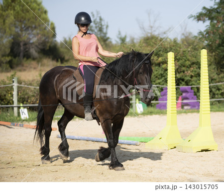 riding girl and horse 143015705