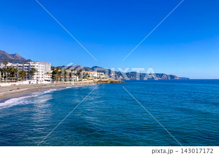 Wonderful landscapes of the shimmering sea and charming city unfold, offering breathtaking coastal views and a picturesque atmosphere in Nerja, Spain Wonderful landscapes of the shimmering sea and charming city unfold, offering breathtaking coastal views and a picturesque atmosphere in Nerja, Spain 143017172