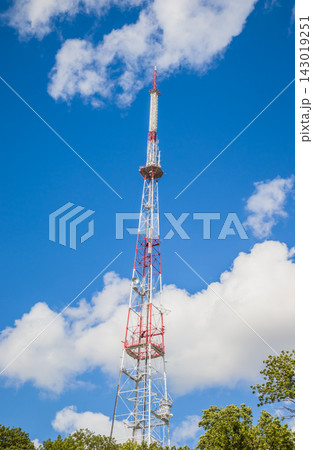 View of communication towers with blue sky. Top view of the radio tower in the city View of communication towers with blue sky. Top view of the radio tower in the city 143019251