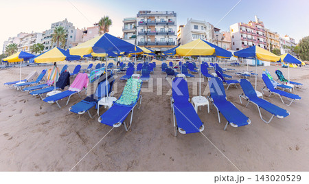 Sun Loungers and Umbrellas on Sandy Beach in Chania, Crete, Greece Sun Loungers and Umbrellas on Sandy Beach in Chania, Crete, Greece 143020529