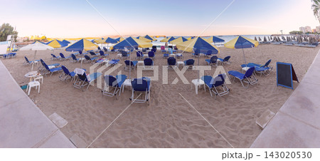 Sun Loungers and Umbrellas on Sandy Beach in Chania, Crete, Greece Sun Loungers and Umbrellas on Sandy Beach in Chania, Crete, Greece 143020530