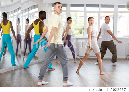 Young man practicing aerobic dance in training hall 143022627