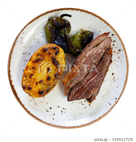 Hot dinner of spiced roast beef with fried potatoes and peppers on white plate. Hot dinner of spiced roast beef with fried potatoes and peppers on white plate. 143022729