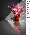 A flower in a mug 143028057