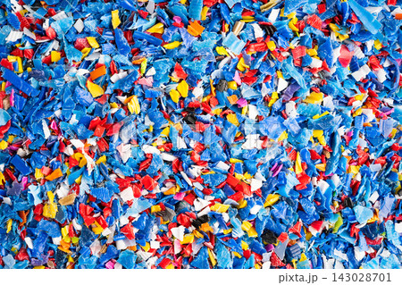 Plastic colorful pieces recycling shredded for industrial use. Plastic colorful pieces recycling shredded for industrial use. 143028701