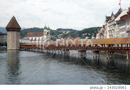 Historic city center of Lucerne with famous Chapel Bridge, the city's symbol and one of the Switzerland's main tourist attractions Historic city center of Lucerne with famous Chapel Bridge, the city's symbol and one of the Switzerland's main tourist attractions 143029061