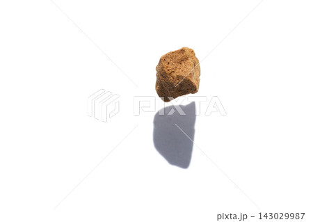 Single Instant Coffee Granule Casting Shadow On White Background Isolated Macro Closeup 143029987