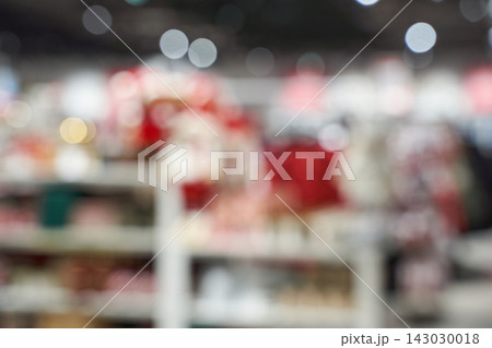 Retail Store Shelves Blurred Out Of Focus With Red Seasonal Merchandise Bokeh Lights And Aisle 143030018