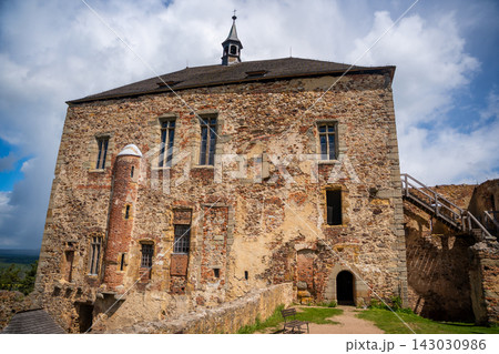 Interior courtyard and stone ruins of Tocnik Castle overlooking the Bohemian countryside. Medieval heritage and preservation concept 143030986