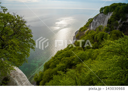 View of famous white chalk cliffs and Baltic Sea from suspension bridge in Jasmund National Park on Ruegen island, Germany 143030988