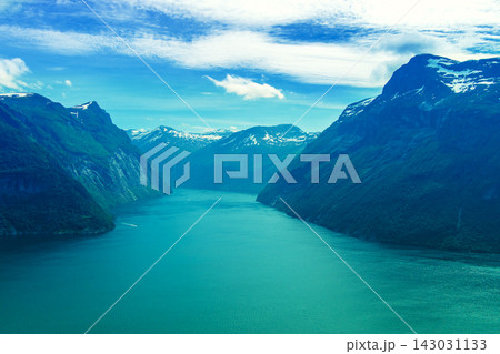 View of the fjord from above. Beautiful Geirangerfjord at sunset, Norway View of the fjord from above. Beautiful Geirangerfjord at sunset, Norway 143031133