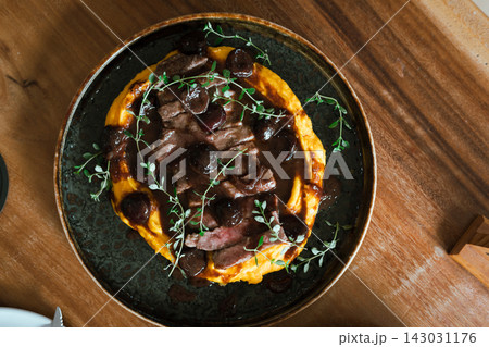 Grilled Australian Striploin with cherry red wine sauce. Grilled Australian Striploin with cherry red wine sauce. 143031176