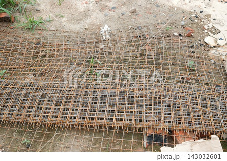 Stacked steel wire mesh at a construction site Stacked steel wire mesh at a construction site 143032601