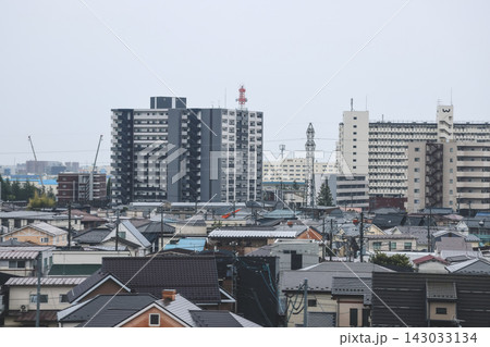 April 27 2026 Morioka urban residential rooftops with powerlines and distant skyline 143033134
