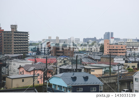 April 27 2026 Morioka urban residential rooftops with powerlines and distant skyline 143033139