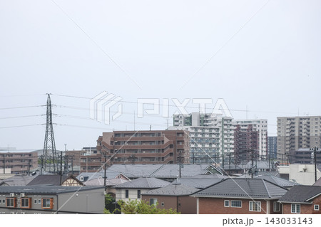 April 27 2026 Morioka urban residential rooftops with powerlines and distant skyline 143033143
