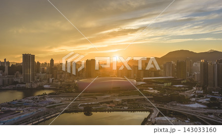 Hong Kong, July 10 2026 Golden Sunset Above Kai Tak Sports Park Skyline Hong Kong, July 10 2026 Golden Sunset Above Kai Tak Sports Park Skyline 143033160