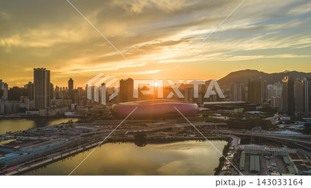Hong Kong, July 10 2026 Golden Sunset Above Kai Tak Sports Park Skyline Hong Kong, July 10 2026 Golden Sunset Above Kai Tak Sports Park Skyline 143033164