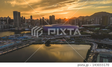 Hong Kong, July 10 2026 Golden Sunset Above Kai Tak Sports Park Skyline Hong Kong, July 10 2026 Golden Sunset Above Kai Tak Sports Park Skyline 143033170