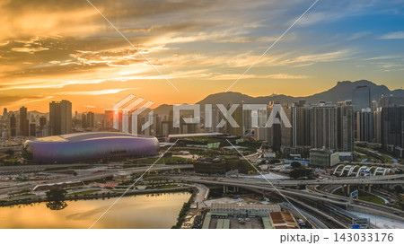 Hong Kong, July 10 2026 Golden Sunset Above Kai Tak Sports Park Skyline Hong Kong, July 10 2026 Golden Sunset Above Kai Tak Sports Park Skyline 143033176