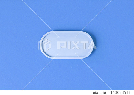 Podium for cosmetic product presentation. Abstract minimal geometrical form on blue background. Oval stone form. Scene, Showcase, display. Minimal design. Soft shadow. Flat lay, Top View. Copy space Podium for cosmetic product presentation. Abstract minimal geometrical form on blue background. Oval stone form. Scene, Showcase, display. Minimal design. Soft shadow. Flat lay, Top View. Copy space 143033511