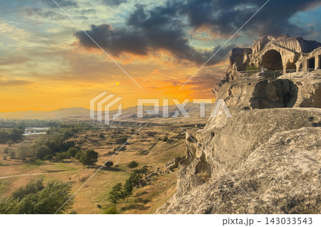 Uplistsikhe ancient rock town and sunset sky cloud near Gori Shida Kartli in Georgia 143033543