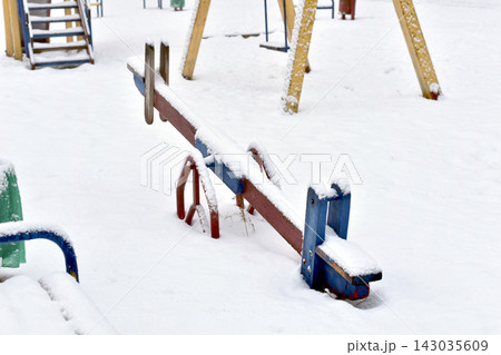 Playground with swings in winter. 143035609