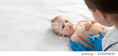 Doctor vaccinating baby in clinic. Little baby get an injection. Pediatrician vaccinating newborn baby. Vaccine for infant child. Child's Immunization, Children's Vaccination, Health concept Doctor vaccinating baby in clinic. Little baby get an injection. Pediatrician vaccinating newborn baby. Vaccine for infant child. Child's Immunization, Children's Vaccination, Health concept 143036634