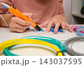 Teen Girl Using 3d Pen. Printing with Colored Plastic Wire Filament. Child making a House, drawing with 3D pen. Artwork, Robotics. STEAM, STEM education. Modern Technologies. Play and study at home 143037595