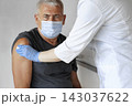 Doctor Vaccinating Senior Man In Clinic. Older People Vaccination. Doctor Giving Monkeypox or COVID Vaccine Injection to Mature Man In Face Mask. Protection of Elderly Patient. Old Man in Hospital 143037622