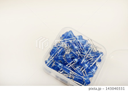 Blue LEDs in a plastic box. Semiconductor diodes. Electronic components. Blue LEDs in a plastic box. Semiconductor diodes. Electronic components. 143040331