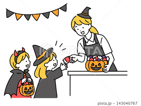 ハロウィンに子どもにお菓子を渡すスタッフ ハロウィンに子どもにお菓子を渡すスタッフ 143040767