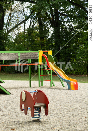 Children playground with colorful slides and climbing structures in park Children playground with colorful slides and climbing structures in park 143040953