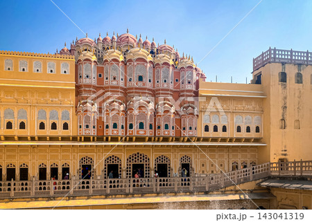 View of the Hawa Mahal (Palace of the Winds) in Jaipur through a stone arch View of the Hawa Mahal (Palace of the Winds) in Jaipur through a stone arch 143041319