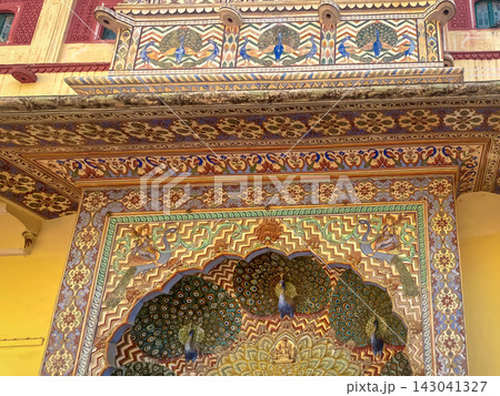 A colorful ceiling painting featuring peacocks, ornaments, and slanted motifs in a palace in Jaipur, India. A colorful ceiling painting featuring peacocks, ornaments, and slanted motifs in a palace in Jaipur, India. 143041327