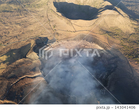 Big volcano crater with smoke and lava in Nicaragua Big volcano crater with smoke and lava in Nicaragua 143041406