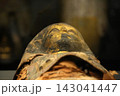 Ancient Egyptian Mummy with Golden Funerary Mask 143041447