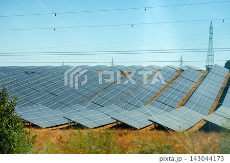 Long rows of modern solar panels generation system installed outdoors 143044173