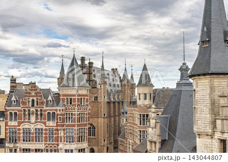 Antwerp town in Belgium, Europe. Dramatic cloudy sky over historic European city buildings, featuring intricate architecture, turrets, and traditional facades Antwerp town in Belgium, Europe. Dramatic cloudy sky over historic European city buildings, featuring intricate architecture, turrets, and traditional facades 143044807
