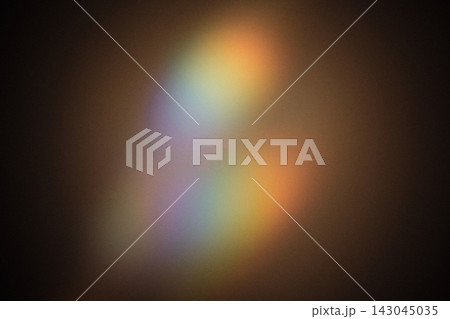 Soft colorful light spectrum refracting across dark background, creating bokeh effects Soft colorful light spectrum refracting across dark background, creating bokeh effects 143045035