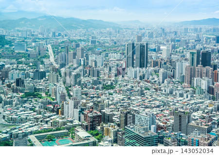 Panoramic aerial view of cityscape, skyline and urban sprawl of Taipei in Taiwan under sun, bright blue sky Panoramic aerial view of cityscape, skyline and urban sprawl of Taipei in Taiwan under sun, bright blue sky 143052034